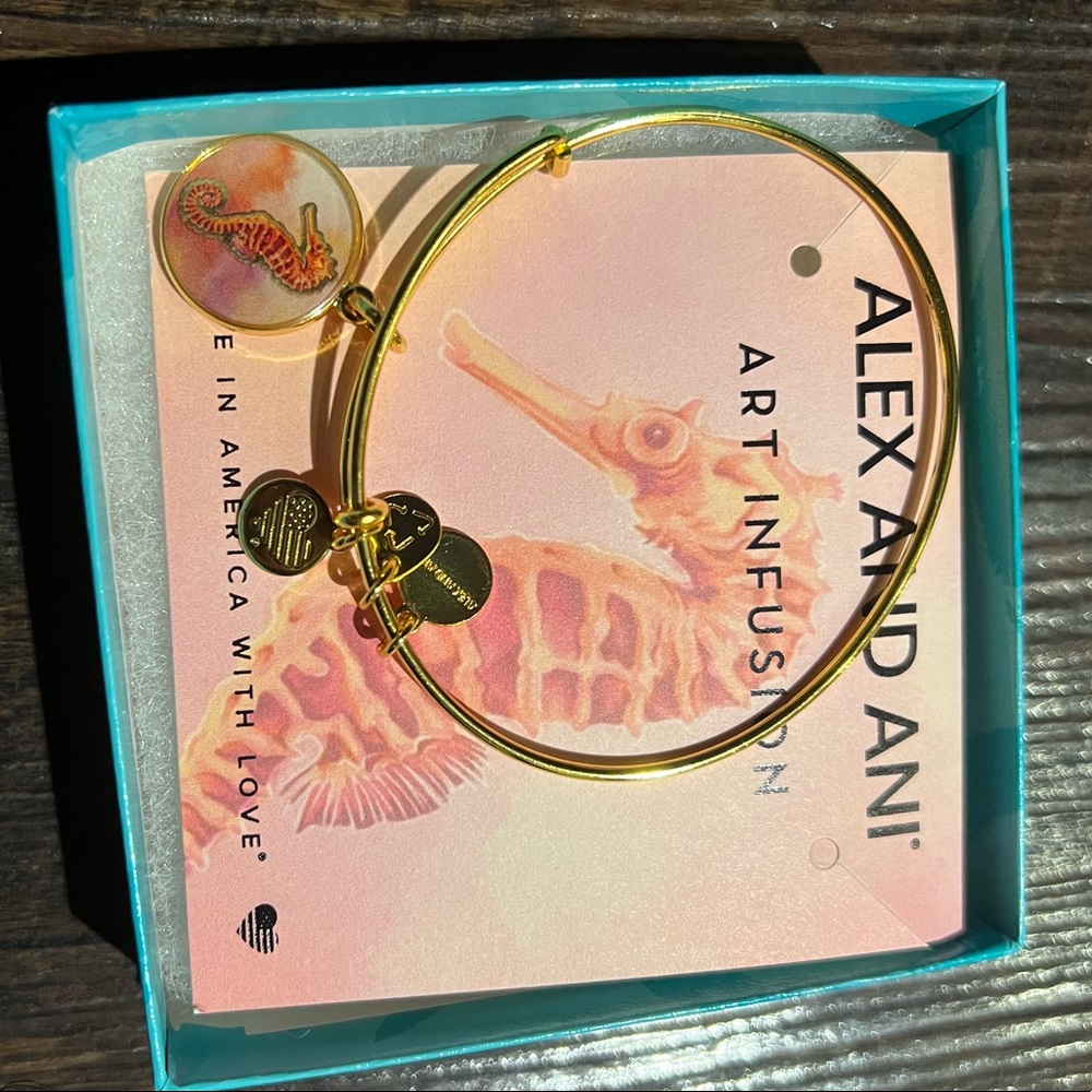 Alex And Ani pink / salmon colored seahorse charm gold bracelet